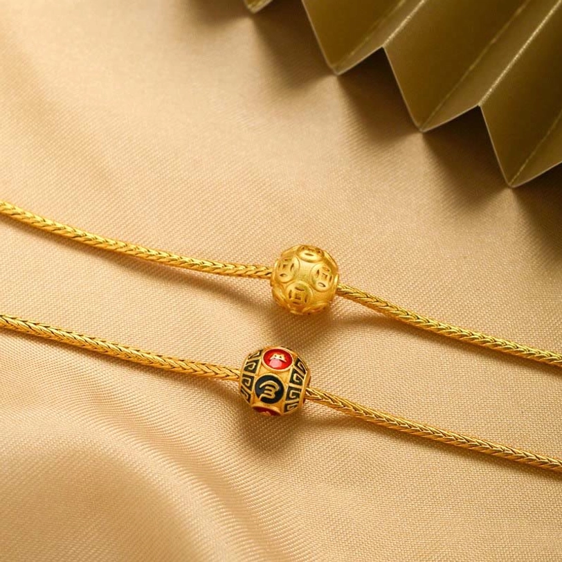 Two styles of Tibetan spiritual bracelets side by side showing smooth gold bead and mantra charm