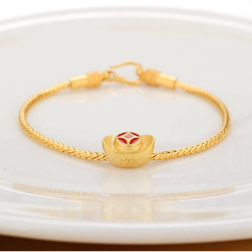 Gold ingot charm Tibetan bracelet featuring traditional wealth abundance symbol with enamel detail