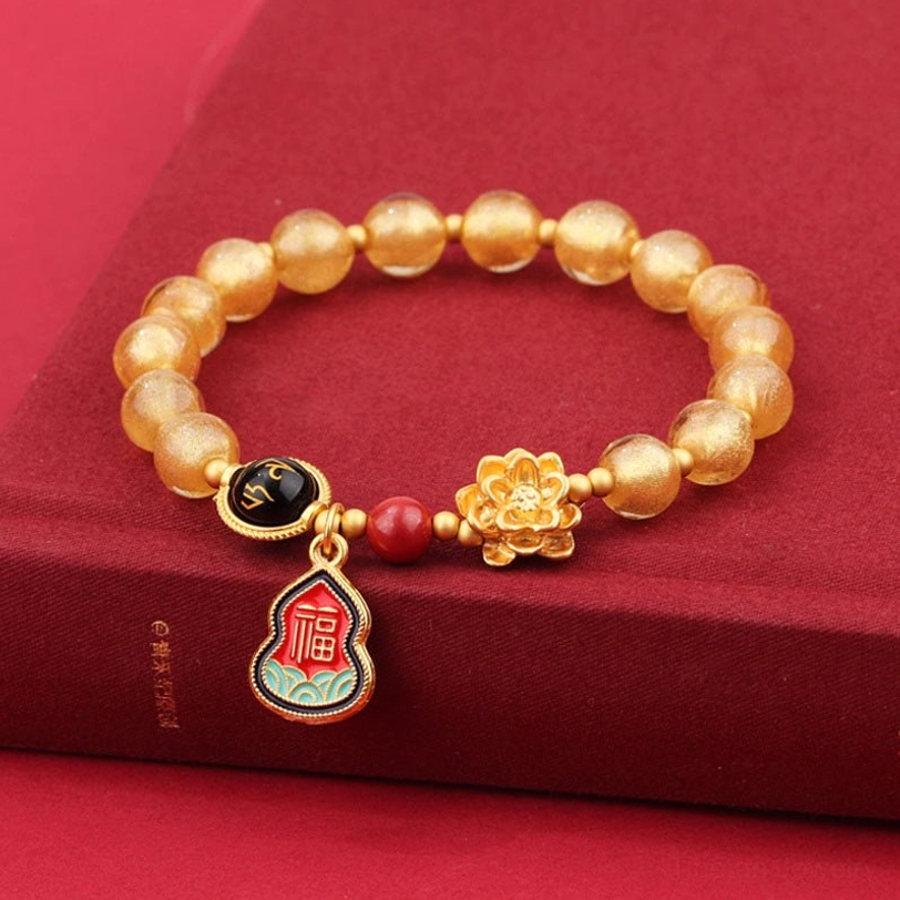 Tibetan Om Mani Padme Hum bracelet in gold Liuli glass beads with sacred Sanskrit mantra charm and lotus accent