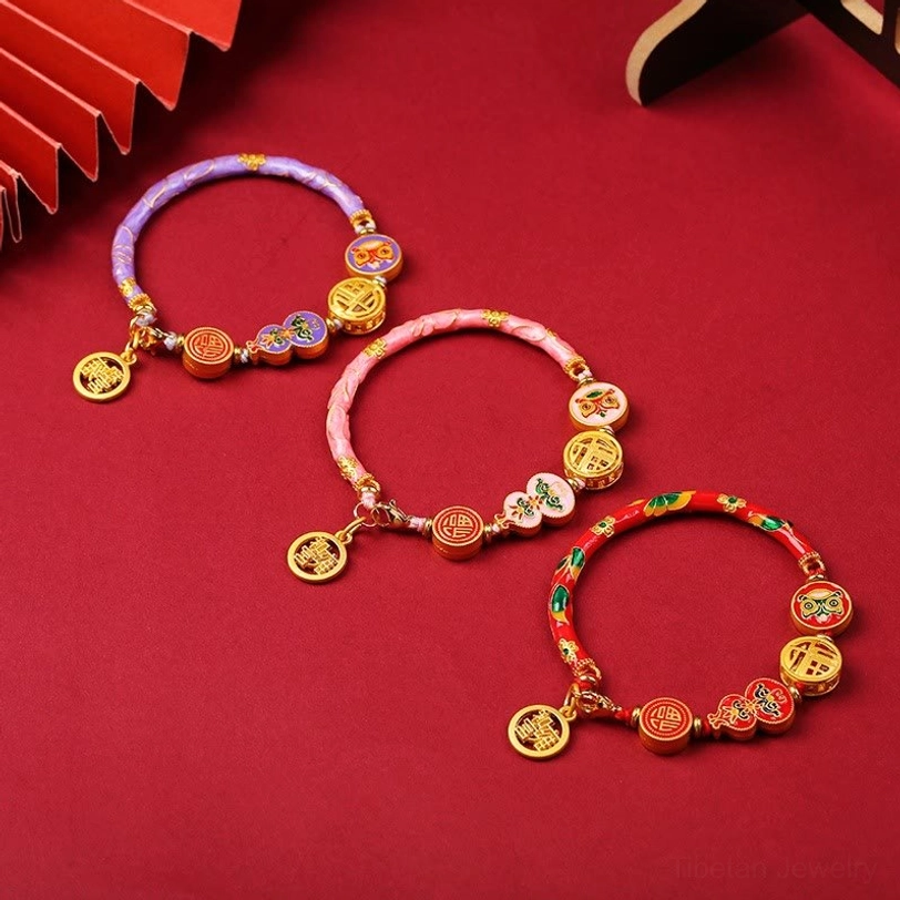 Tibetan gourd prosperity copper bracelet close-up detail showing lion symbol and intricate enamel work