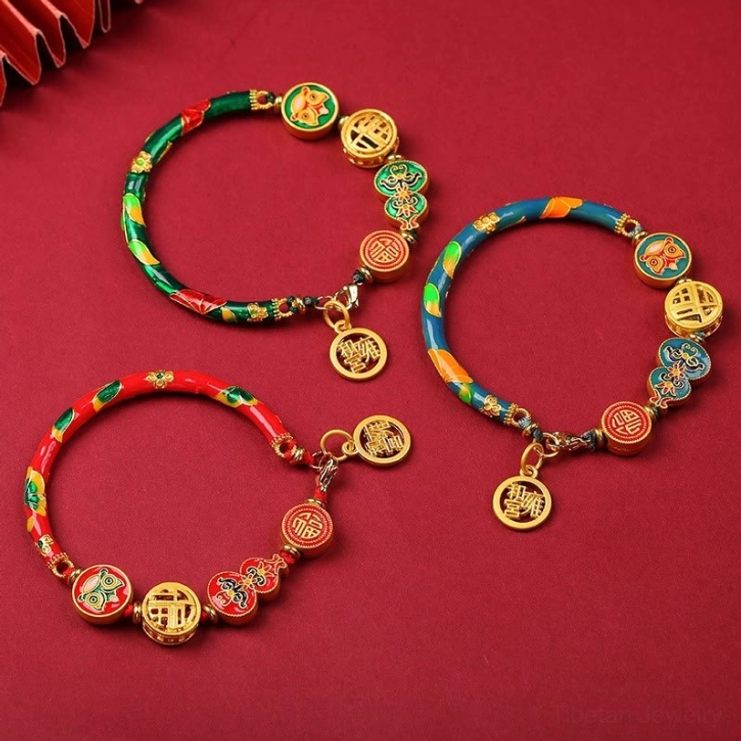 Tibetan gourd prosperity bracelets in multiple colors - red, blue, green, pink - with copper lion charms and fortune pendants on red background