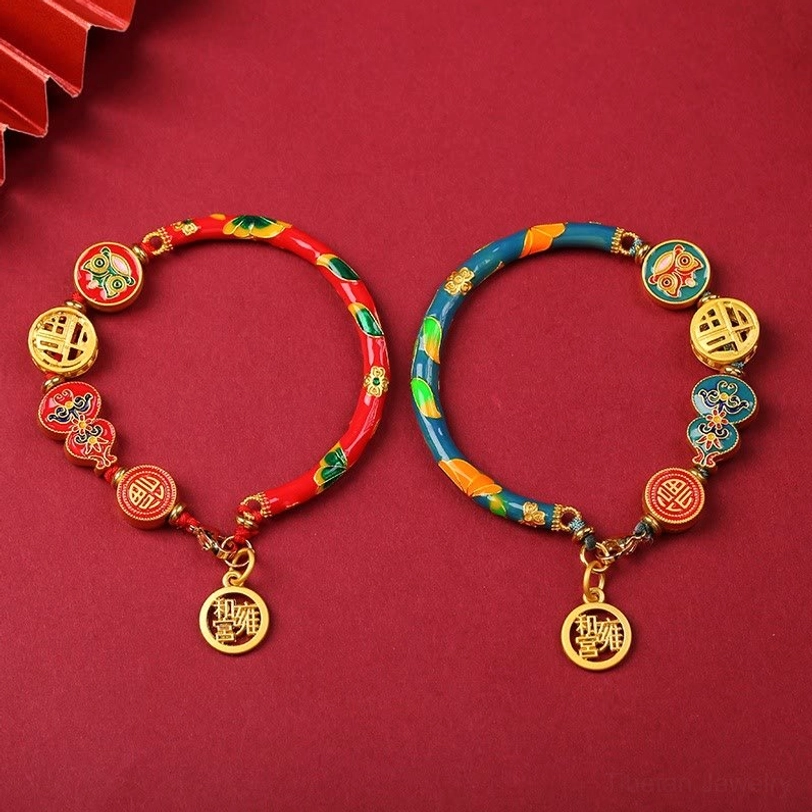 Two handmade Tibetan gourd bracelets - one red-toned and one blue-toned with hanging fortune tags