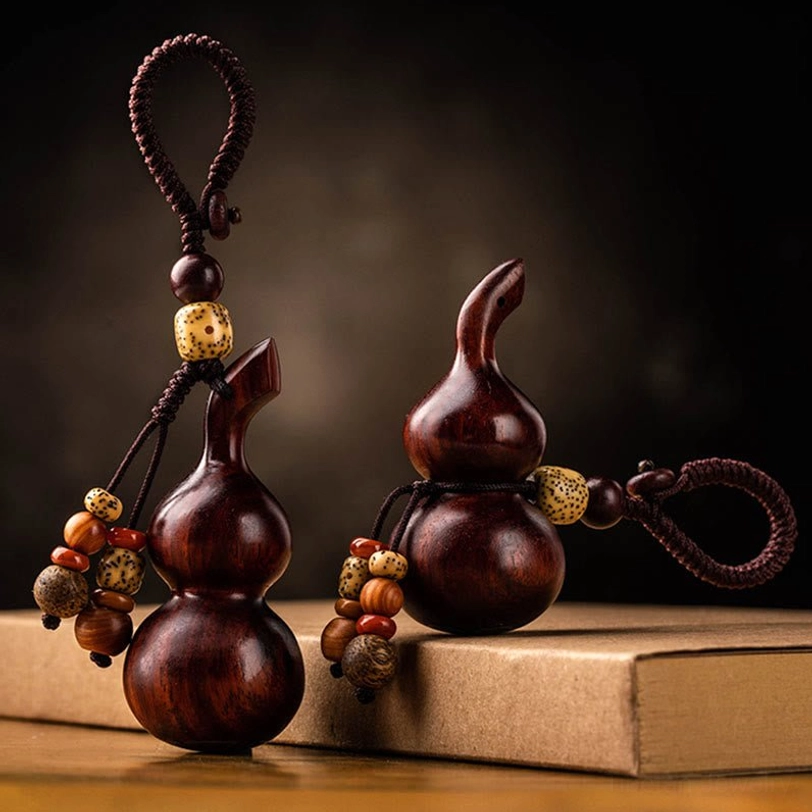 Tibetan ebony and sandalwood gourd keychain collection showcase featuring multiple authentic handcrafted styles with varied bead tassel designs