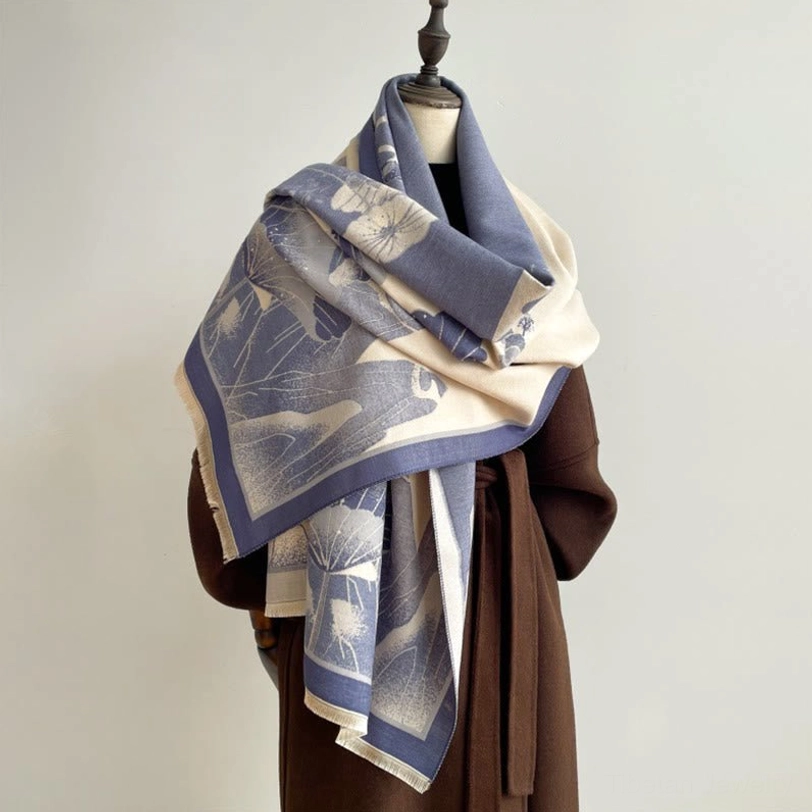 Tibetan lotus mountain wrap in blue gradient tones with detailed landscape pattern, side three-quarter view on model