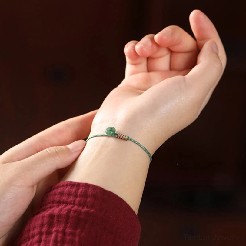 Tibetan green aventurine braided bracelet worn on wrist showing fit and authentic handmade design