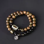 Green sandalwood gold sheen obsidian double wrap bracelet top view with Buddha charm