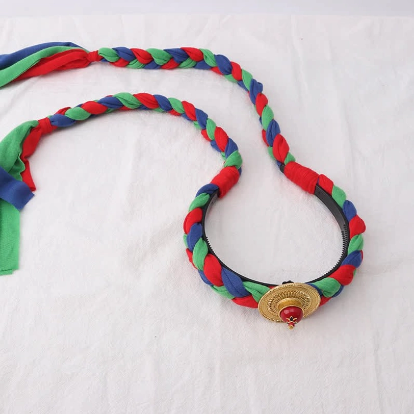 Tibetan style hair braid accessory with red green blue woven bands, small gold charm with gemstone and fabric tassels