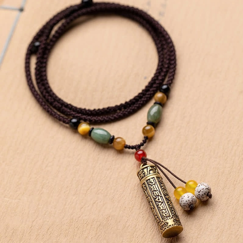 Handcrafted Tibetan Om Mani Padme Hum necklace with jade, tiger eye, and red agate for chakra balancing
