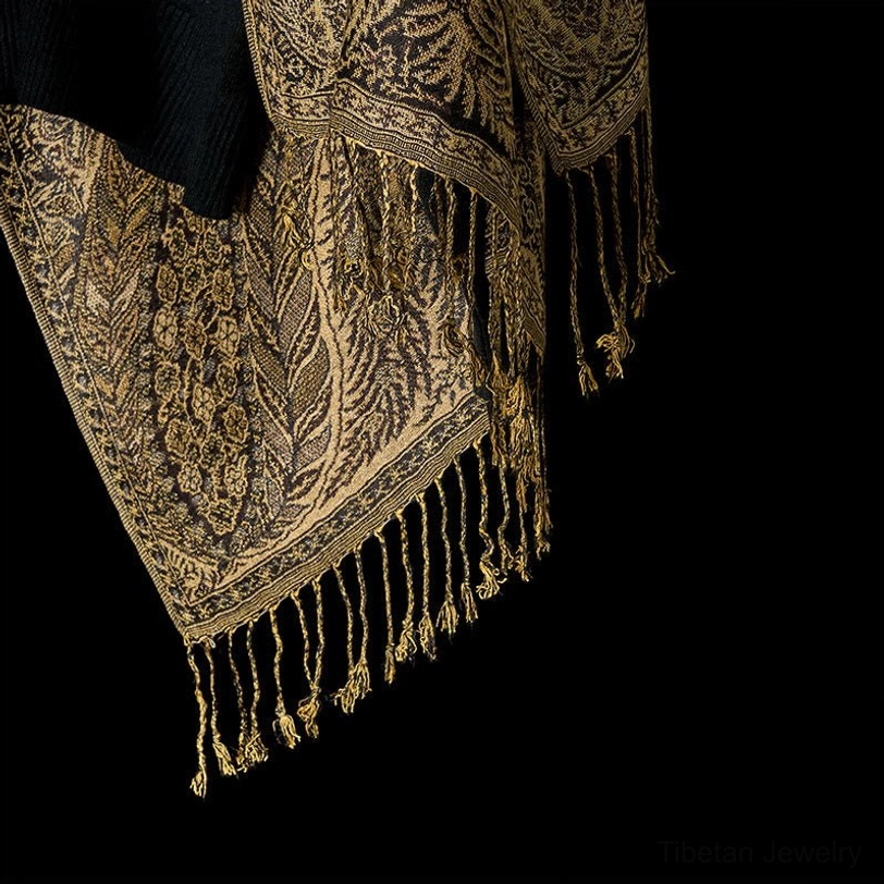 Tibetan handcrafted shawl showcasing traditional paisley weave and tassel detailing for spiritual and cultural appreciation