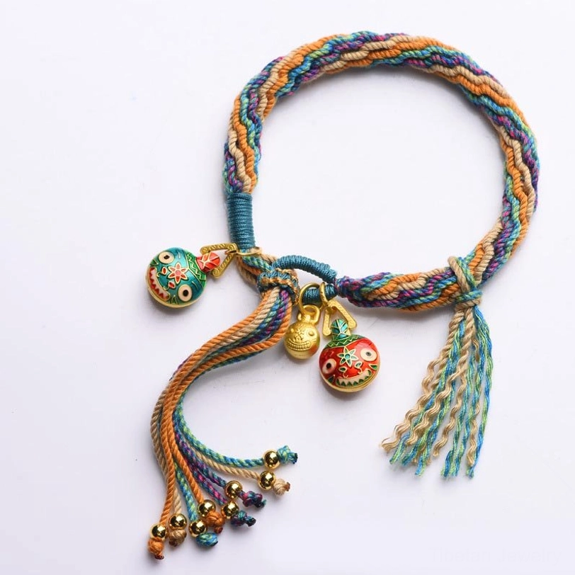 Authentic handmade Tibetan protective beast bracelet with natural cotton cord and enamel metal charms