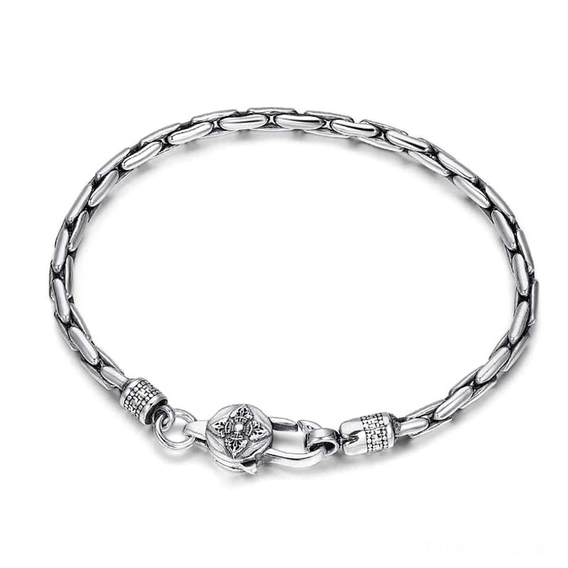 Handmade tibetan Buddhist silver bracelet showing intricate dorje and mantra craftsmanship