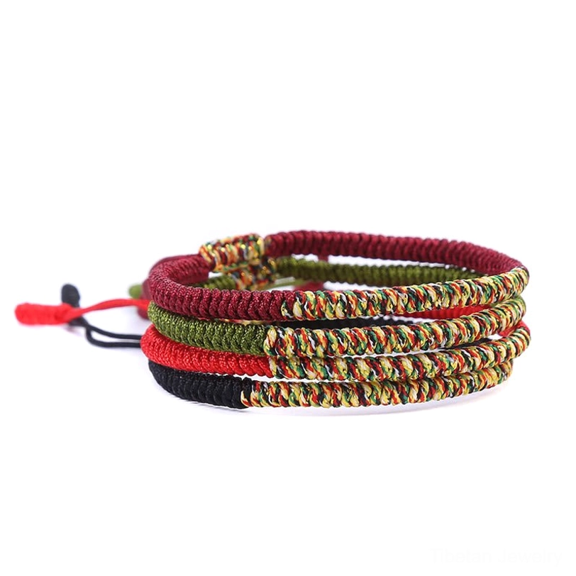 Handmade Tibetan braided friendship bracelet with King Kong knot, multicolor threads representing Buddhist spiritual symbolism