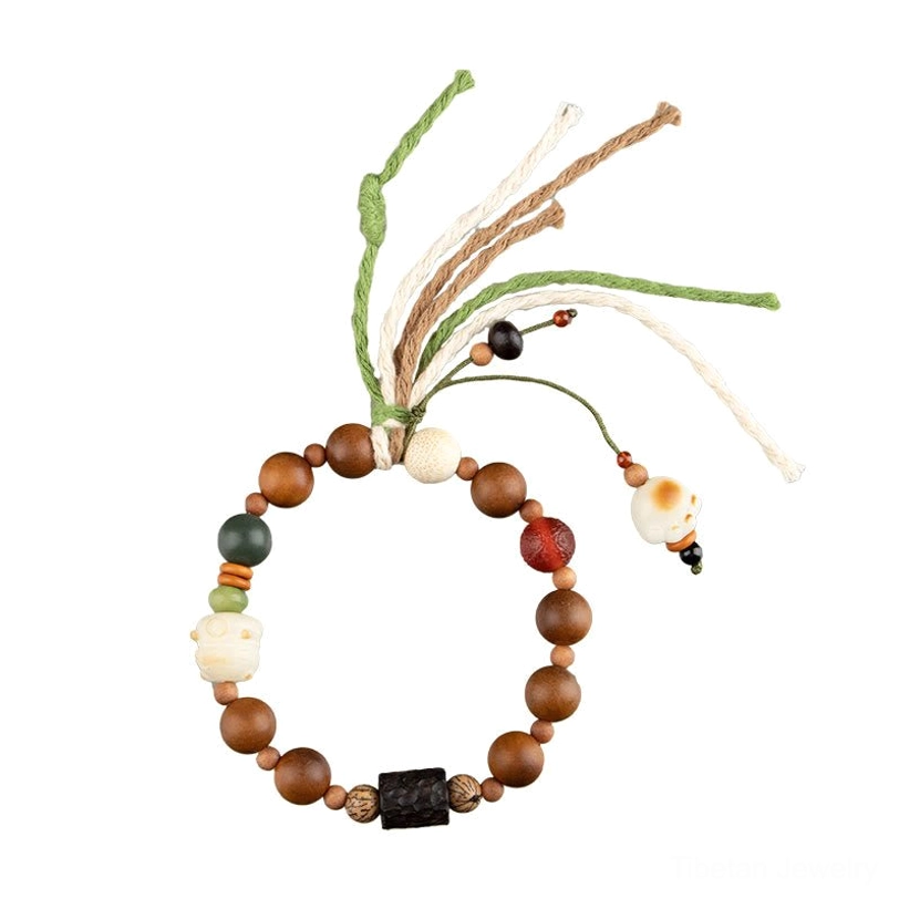 Authentic handmade Tibetan protection bracelet with lightning strike wood beads, cat paw amulet, and spiritual tassel charm