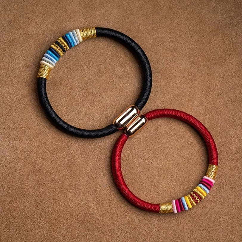 Handmade Tibetan magnetic bracelet featuring Vajra Knot symbol, colorful decorative bands, spiritual talisman