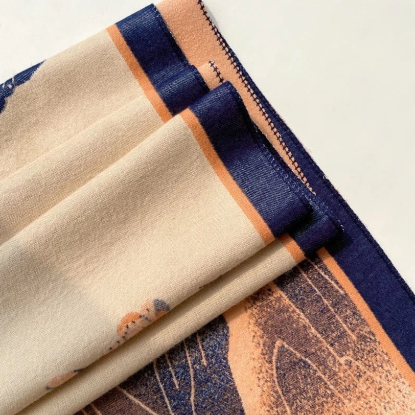 Tibetan handwoven lotus mountain wrap with traditional Himalayan landscape and spiritual symbolism