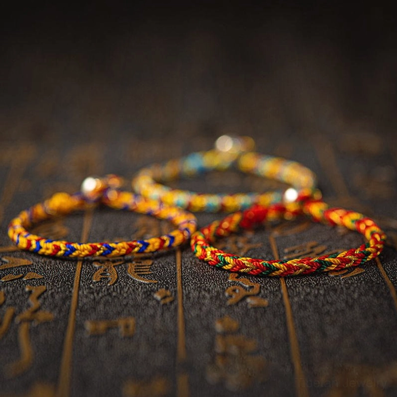 Tibetan handwoven protection bracelet multicolor thread with sterling silver clasp detail
