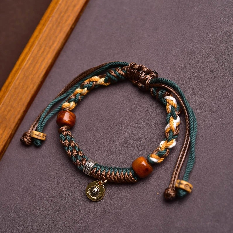 Tibetan rope bracelet with 18K gold-plated copper accents and silver components for lasting shine