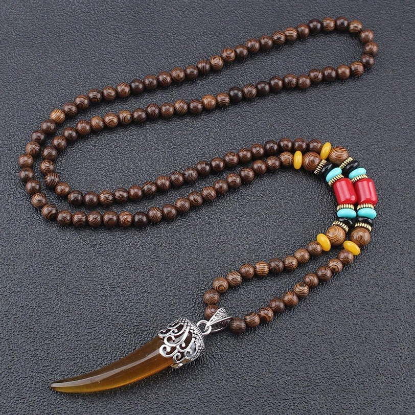 Brown resin horn pendant necklace with silver carved cap - Tibetan inspired amulet close-up