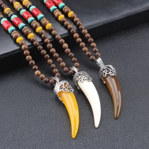 Set of three Tibetan horn pendant necklaces in white, yellow, and brown with matching beaded chains - complete collection display