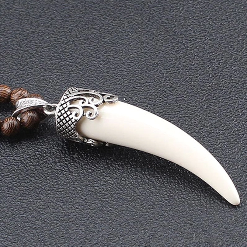 White resin horn pendant with silver carved cap and colorful beads on wenge wood strand - complete necklace display