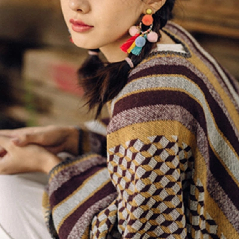 Tibetan houndstooth shawl wrap layered over casual outfit demonstrating easy integration into wardrobe