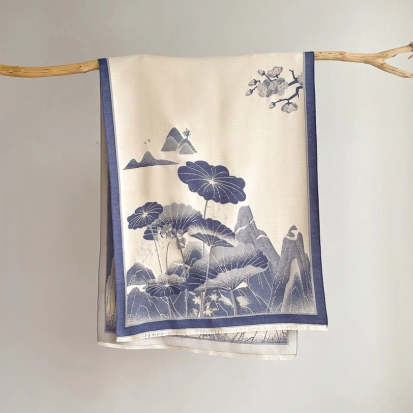 Tibetan indigo blue mountain shawl with lotus print and blue border, flat hanging display on studio background