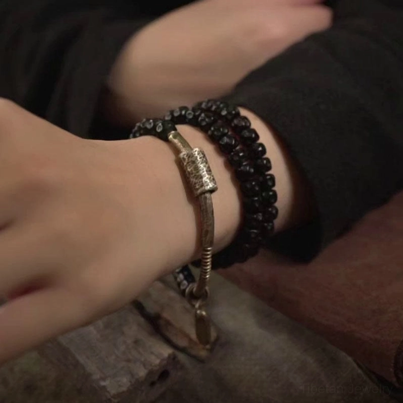 Coconut shell and brass bracelet layered wrap design - authentic Tibetan-inspired spiritual jewelry