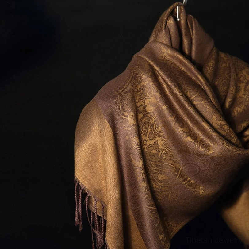 Tibetan paisley jacquard scarf side view - hanging with tassel trim detail