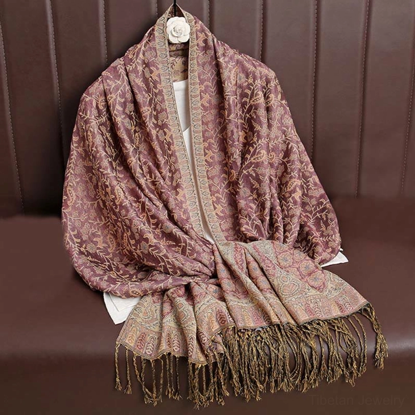Tibetan jacquard shawl in Indian red warm tone showcasing how color variations celebrate handcrafted artisan authenticity