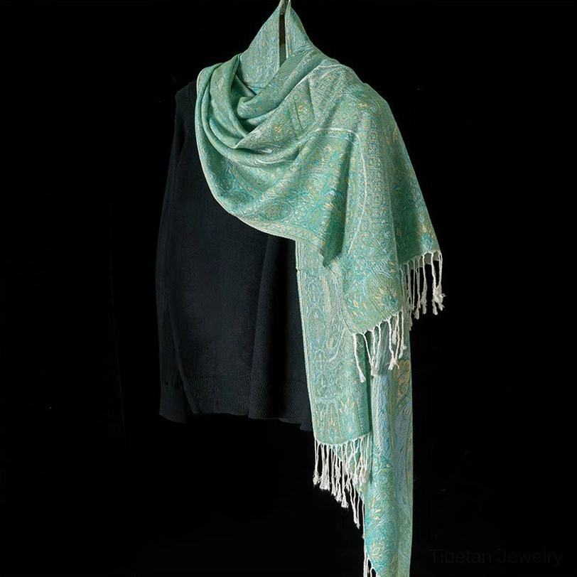 Mint green Tibetan jacquard scarf shawl right three-quarter view showing neat white tassel hem and full jacquard print coverage