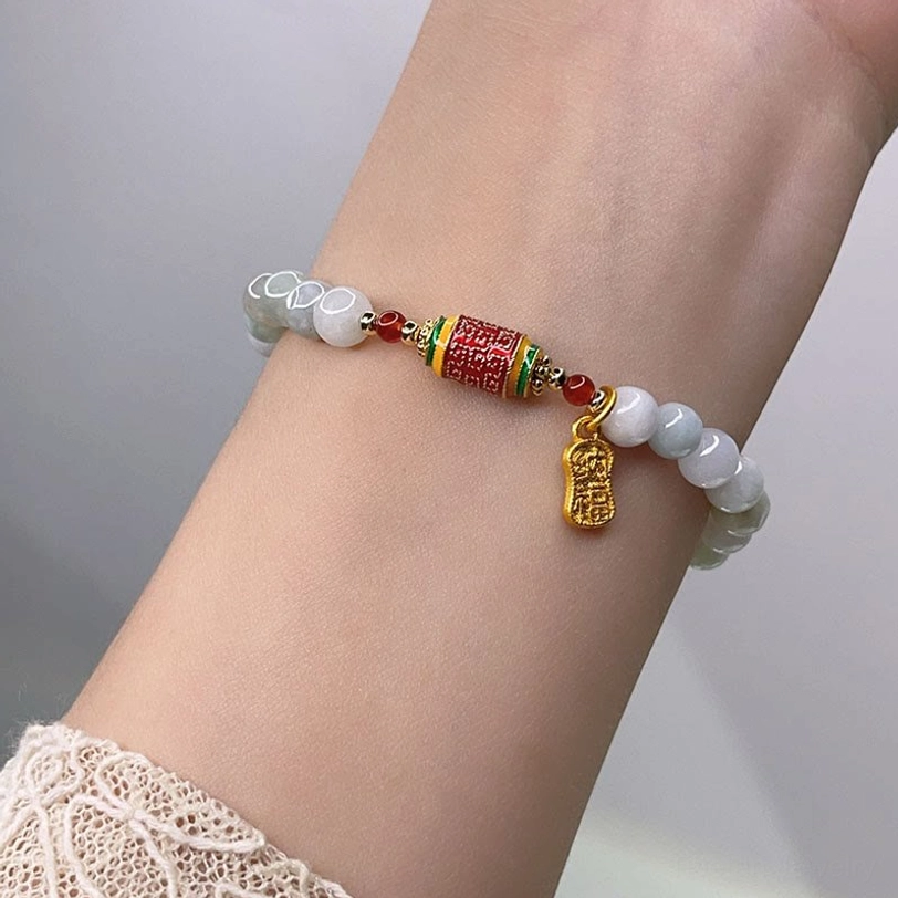 Jade fu prayer bracelet worn on wrist with lace sleeve showing natural fit and comfort