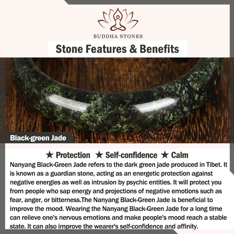 Tibetan black-green jade peace buckle necklace and product information card on wooden surface