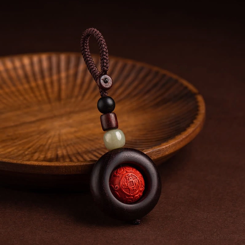 Hand-carved Tibetan mantra keychain showing master craftsman artisanal quality and detail