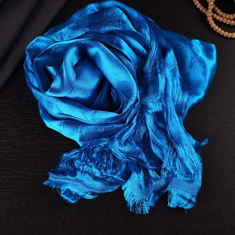 Tibetan blue 5-color jacquard khata ceremonial scarf, overhead display with royal blue silk finish