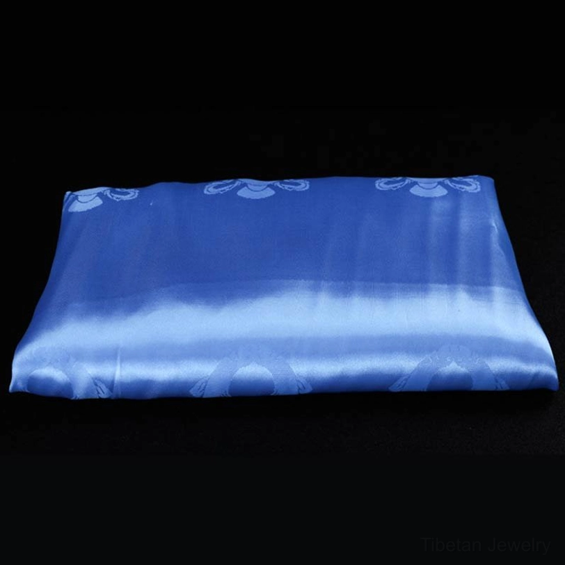 Single blue Tibetan khata scarf with tranquil satin finish and embossed spiritual blessing motifs