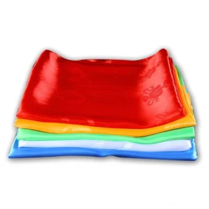 Stacked Tibetan khata scarves from overhead showing all five colors - white, yellow, blue, green, and red with smooth satin finish
