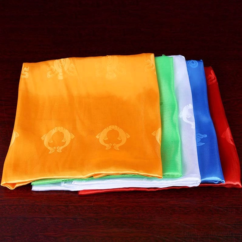 Tibetan khata ceremonial scarves displayed showing traditional tasseled edges and satin fabric quality