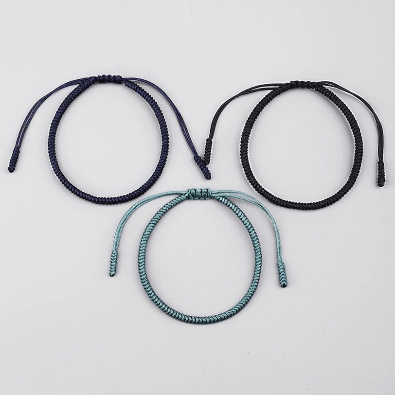 Three Tibetan King Kong knot bracelets mixed colors displayed in circular top-down view