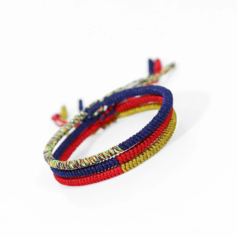 Tibetan multicolor woven protection bracelet with adjustable rope ties displayed from front view