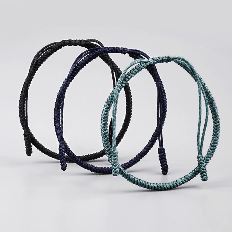 Three handcrafted King Kong knot bracelets arranged in circular pattern showcasing braided cord design