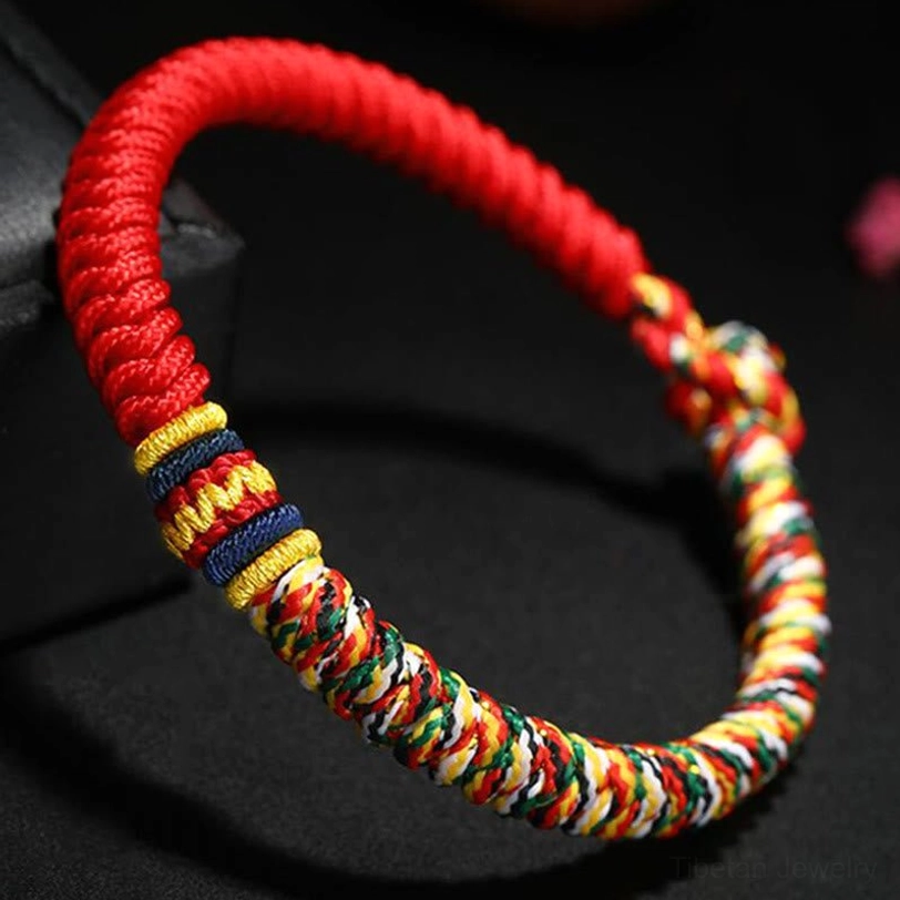 Tibetan King Kong Knot red braided bracelet side perspective showing handwoven texture and colorful accents