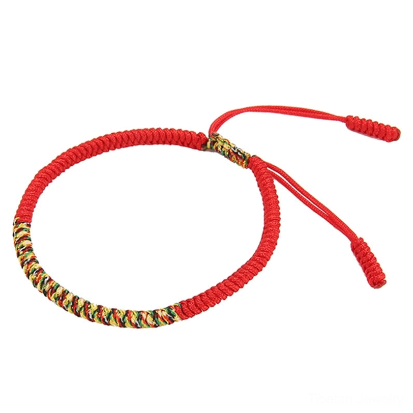 Tibetan handmade King Kong knot bracelet worn on model's wrist, side profile view showing braided knot detail and red tassel