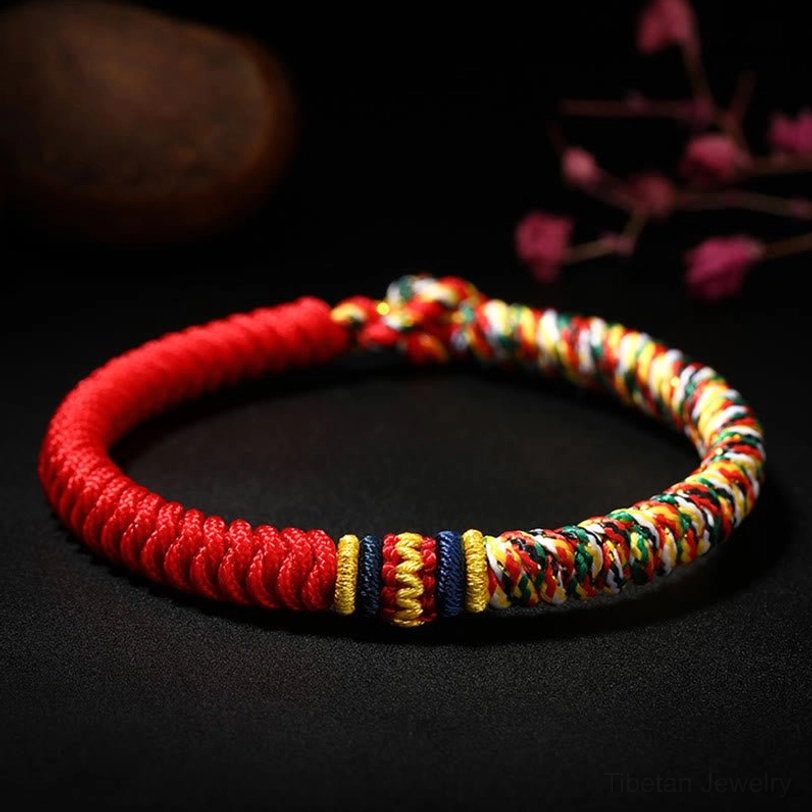 Tibetan King Kong Knot red multicolored braided bracelet overhead close-up view with handwoven details