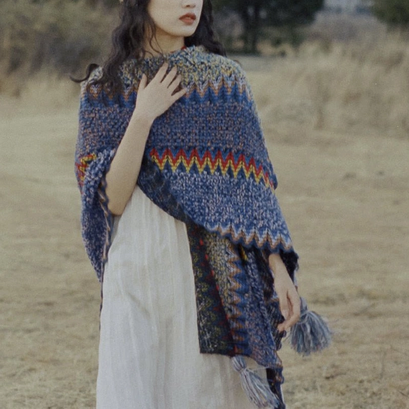 Full body styled shot of Tibetan knit poncho shawl paired with casual outfit for bohemian aesthetic