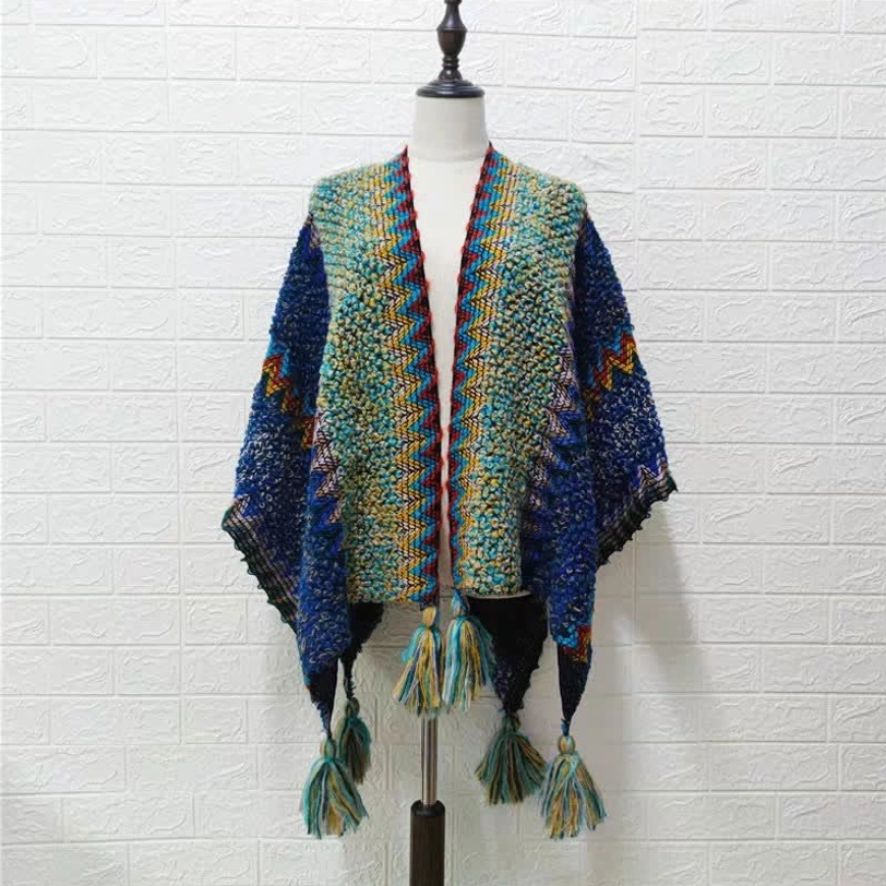 Evening wear styling of Tibetan knit shawl draped elegantly over formal dress for sophisticated look