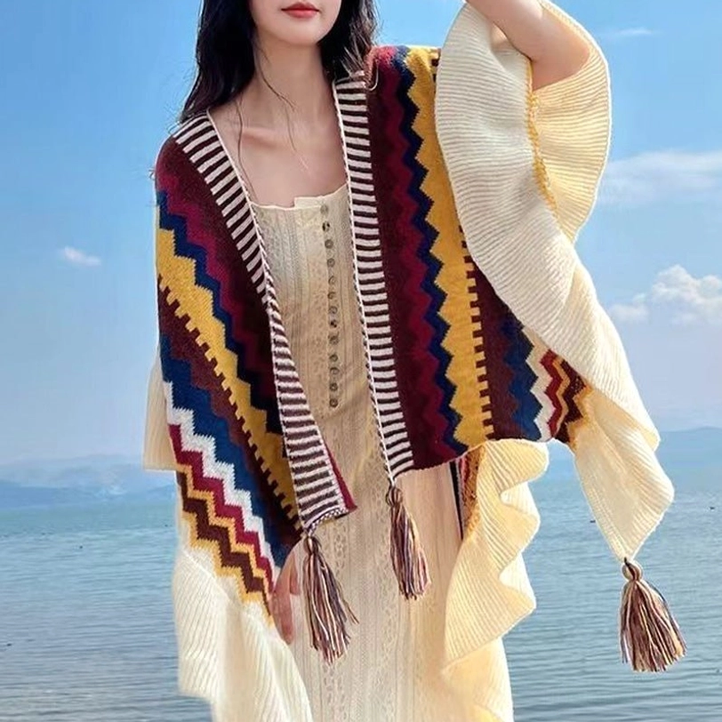 Tibetan knit shawl in vibrant striped colors ideal for layering over dresses and creating bohemian-inspired outfits