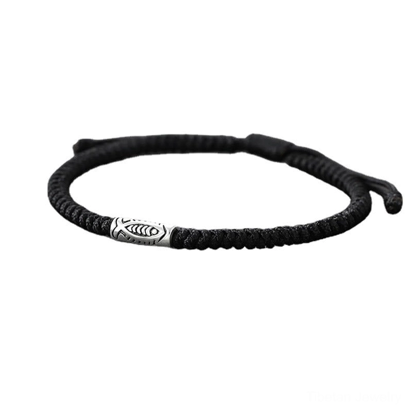 Koi fish black string bracelet front flat lay showing braided rope and adjustable pull cord