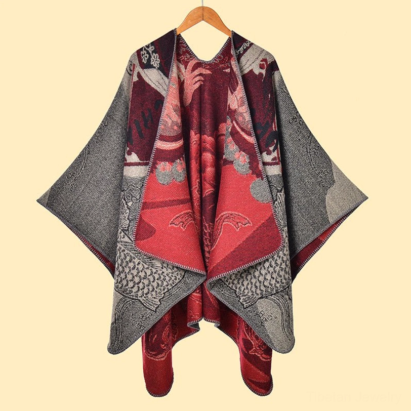 Tibetan reversible koi poncho shawl hanging display showing jacquard weave and red inner lining