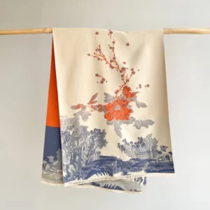 Handwoven Tibetan peony and landscape print scarf displayed flat showing cream base with vintage ink-wash painting design and frayed hem