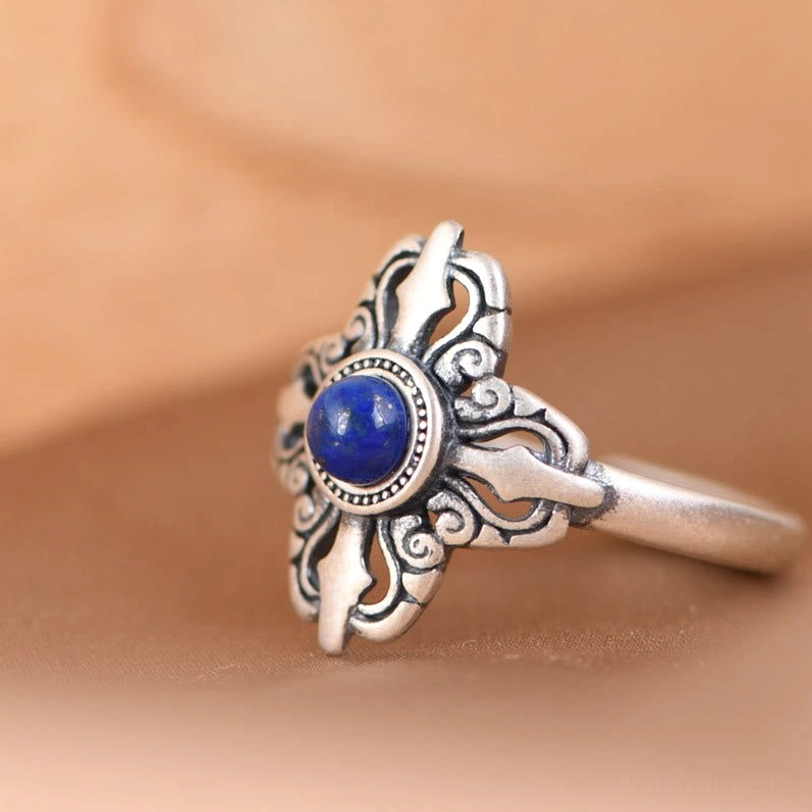 Tibetan style lapis lazuli sterling silver ring oblique angle showing cross-shaped silver mount